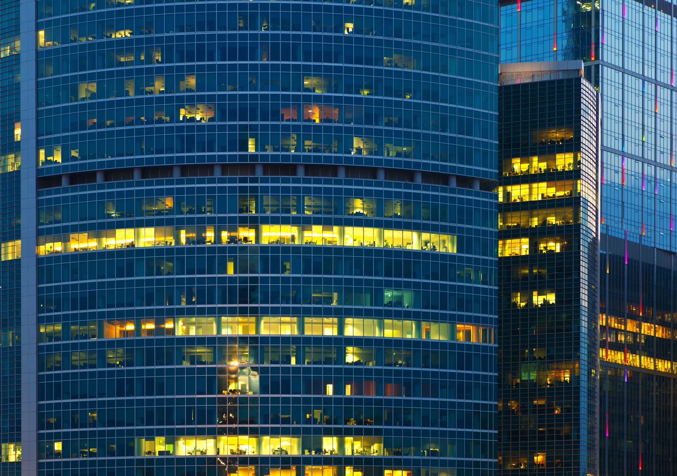 Close up of offices in Skyscraper lit up at night