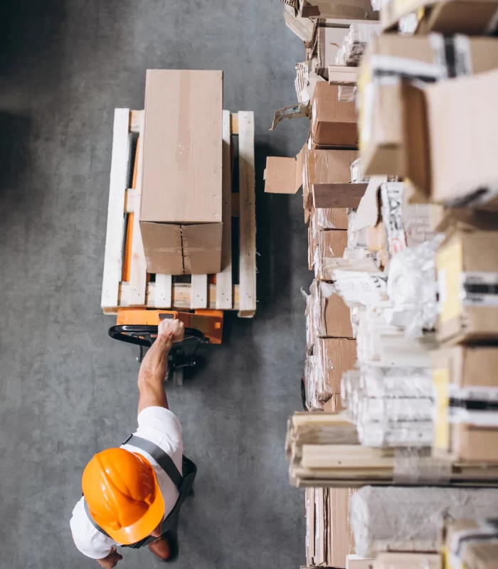 Man working in warehouse with boxes